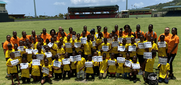 Kids Athletics Coaches from across NACAC with children at last year’s training in SVG